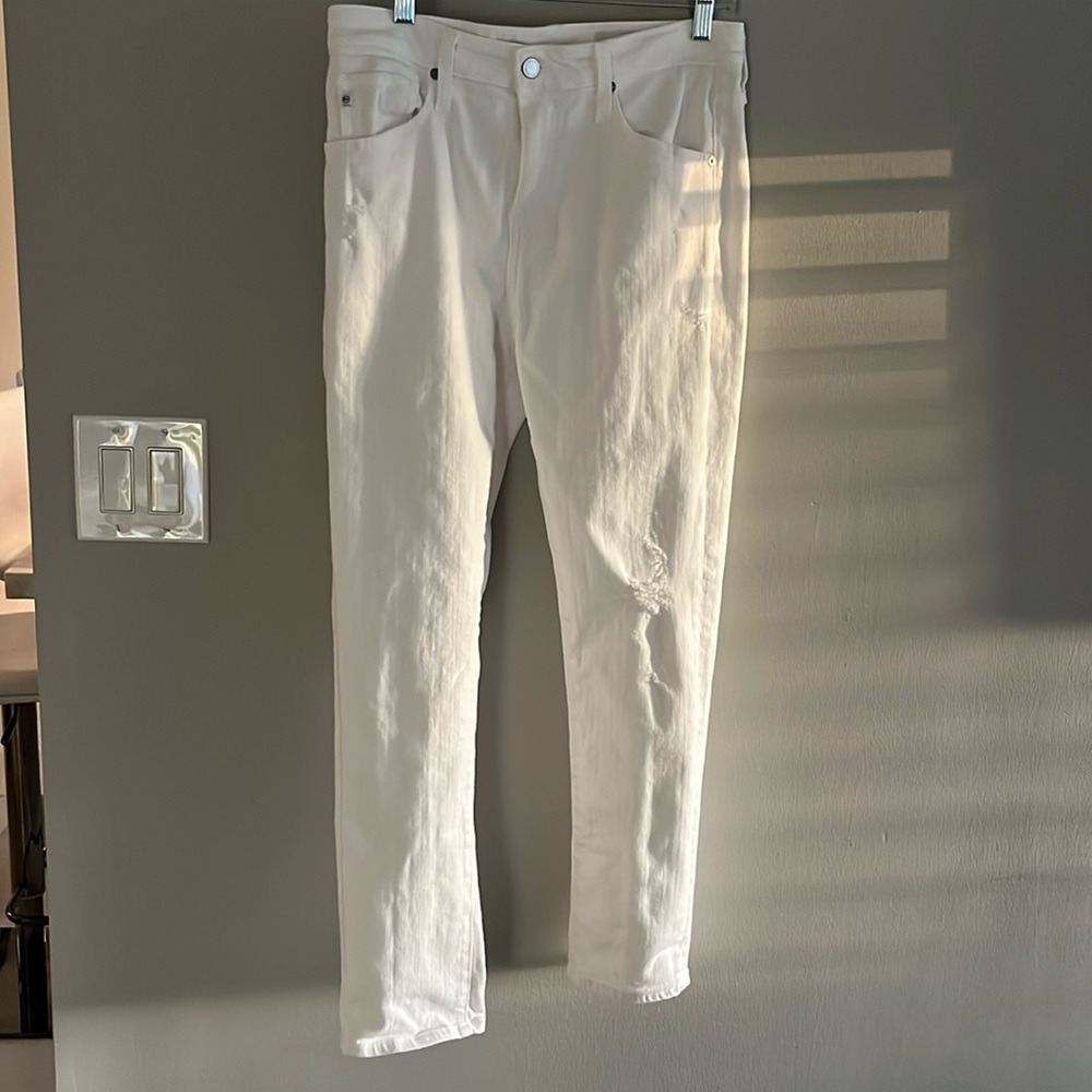 White lightly distressed jeans slouchy slim size 27 by AG. Like new condition
